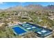 Overhead view of pickleball courts surrounded by native desert plants and beautiful mountains in the background at 10588 E Tierra Buena Ln, Scottsdale, AZ 85255