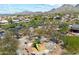 Aerial view of a community playground with slides and climbing features, surrounded by native desert landscaping at 10588 E Tierra Buena Ln, Scottsdale, AZ 85255