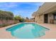 Large backyard features a refreshing pool, and a covered patio at 11305 W Monte Vista Rd, Avondale, AZ 85392