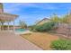 Spacious backyard with refreshing pool and lush landscape at 11305 W Monte Vista Rd, Avondale, AZ 85392