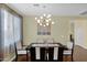 The formal dining area features contemporary lighting and comfortable seating for sophisticated dining experiences at 11305 W Monte Vista Rd, Avondale, AZ 85392