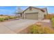 This home boasts a two-car garage, a spacious driveway, and desert landscaping for easy maintenance at 11305 W Monte Vista Rd, Avondale, AZ 85392