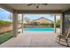 Covered patio with a view of the pool and backyard at 11305 W Monte Vista Rd, Avondale, AZ 85392