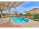 Inviting backyard pool and covered patio, perfect for outdoor entertaining and relaxation at 11305 W Monte Vista Rd, Avondale, AZ 85392