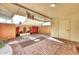 Covered patio featuring brick floors, shade sail, and decorative plantings at 13808 N Silverbell Dr, Sun City, AZ 85351