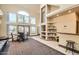 Well-lit lobby area with seating, tables, and a community library at 14000 N 94Th St # 3190, Scottsdale, AZ 85260