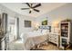 Bright main bedroom featuring neutral colors, a ceiling fan and large windows that provide natural light at 14000 N 94Th St # 3190, Scottsdale, AZ 85260