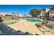 Sparkling community pool and spa area surrounded by lounge chairs at 14000 N 94Th St # 3190, Scottsdale, AZ 85260