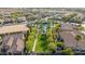 An aerial shot highlights a community pool and green space nestled between residences at 15145 W Catalina Dr, Goodyear, AZ 85395