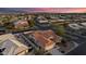 Beautiful aerial shot of the house with its desert landscaping, terracotta roof, and proximity to neighborhood streets at 15145 W Catalina Dr, Goodyear, AZ 85395