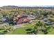 Aerial view of the community clubhouse featuring a covered patio and manicured lawns at 15145 W Catalina Dr, Goodyear, AZ 85395