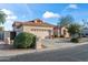 Charming single-Gathering home featuring a well-manicured front yard, desert landscaping and a two-car garage at 15145 W Catalina Dr, Goodyear, AZ 85395