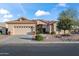 Single-Gathering home with desert landscaping, a tile roof, two car garage and inviting entrance at 15145 W Catalina Dr, Goodyear, AZ 85395