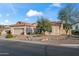 Single-Gathering home boasting beautiful desert landscaping, a tile roof, and neutral color palette at 15145 W Catalina Dr, Goodyear, AZ 85395