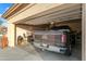 Garage interior featuring a brown GMC truck with open garage door and contents at 15145 W Catalina Dr, Goodyear, AZ 85395