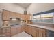 Functional kitchen with ample cabinet space, a double sink, and essential appliances, perfect for everyday meal preparation at 15145 W Catalina Dr, Goodyear, AZ 85395