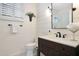 Charming bathroom with a dark wood vanity, white quartz countertop, and modern fixtures; very clean at 15240 N Clubgate Dr # 162, Scottsdale, AZ 85254