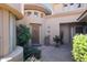 Inviting front entrance features a unique turret design, lush greenery and desert landscaping at 15240 N Clubgate Dr # 162, Scottsdale, AZ 85254