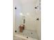 Shower encased in glass, featuring white subway tile and a black mosaic floor, a very clean and inviting space at 15240 N Clubgate Dr # 162, Scottsdale, AZ 85254