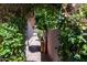 Side yard view with lush landscaping and privacy fence at 15240 N Clubgate Dr # 162, Scottsdale, AZ 85254