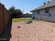 Backyard featuring a pool, rock landscaping, and ample space for outdoor activities at 1531 W Naranja Ave, Mesa, AZ 85202