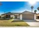 Inviting single-story home with a gray roof, green lawn, and an attached two-car garage at 1531 W Naranja Ave, Mesa, AZ 85202