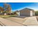 Charming single-story home featuring a two-car garage and a well-maintained front yard at 1531 W Naranja Ave, Mesa, AZ 85202