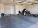 A clean two-car garage featuring white walls and lighting, great for storage at 1531 W Naranja Ave, Mesa, AZ 85202