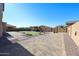 Expansive desert backyard featuring a gazebo, patio area, artificial turf, and mature desert landscaping at 17531 W Hedgehog Pl, Surprise, AZ 85387