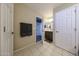 Bathroom featuring double vanity, framed mirror, and neutral tile floor at 17531 W Hedgehog Pl, Surprise, AZ 85387