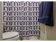 Bathroom featuring a geometric patterned shower curtain with a blue towel at 17531 W Hedgehog Pl, Surprise, AZ 85387