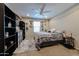 Cozy bedroom featuring neutral colors, carpet, natural light, and a ceiling fan at 17531 W Hedgehog Pl, Surprise, AZ 85387