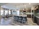 Well-equipped kitchen island with seating, stainless appliances, and adjacent dining area at 17531 W Hedgehog Pl, Surprise, AZ 85387