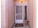 Inviting front entryway featuring a screen door, a welcome mat, and a warm, inviting light at 1871 E Westchester Dr, Chandler, AZ 85249