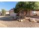 Charming single-Gathering home with a well-maintained front yard and a two-car garage, bathed in warm sunlight at 1871 E Westchester Dr, Chandler, AZ 85249