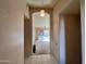 Inviting hallway leading to a living room with natural light and an open floor plan at 1871 E Westchester Dr, Chandler, AZ 85249