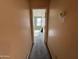 Hallway leading into a room, with a thermostat and a note on the wall at 1871 E Westchester Dr, Chandler, AZ 85249