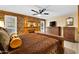 Comfortable bedroom featuring patterned wallpaper, fireplace and neutral furniture at 18835 N Mayan Dr, Sun City, AZ 85373