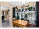 Cozy dining area with natural light and a charming window seat with custom shelving at 18835 N Mayan Dr, Sun City, AZ 85373