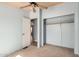 Neutral bedroom features a ceiling fan and standard closet at 19954 W Teepee Rd, Buckeye, AZ 85326