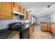 Kitchen with cabinetry, stainless steel sink, and oven at 19954 W Teepee Rd, Buckeye, AZ 85326