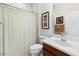 Clean bathroom featuring a shower and a vanity with a sink and a toilet at 21232 N 262Nd Dr, Buckeye, AZ 85396