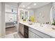 The bathroom features a double vanity, decorative mirrors, and a view into the main bedroom at 25451 N 164Th Dr, Surprise, AZ 85387