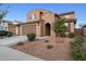 Beautiful two-story home with a two-car garage and desert landscaping featuring decorative gravel and native plants at 25451 N 164Th Dr, Surprise, AZ 85387