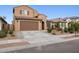 Inviting two-story home with a two-car garage and low-maintenance front yard landscaping at 25451 N 164Th Dr, Surprise, AZ 85387