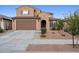 Charming two-story home featuring a two-car garage and a well-maintained, xeriscaped front yard at 25451 N 164Th Dr, Surprise, AZ 85387