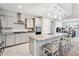 Stylish kitchen featuring granite countertops, a breakfast bar, and stainless steel appliances at 25451 N 164Th Dr, Surprise, AZ 85387