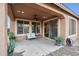 Covered outdoor patio with ceiling fan, recessed lighting, and a comfortable seating area at 25451 N 164Th Dr, Surprise, AZ 85387