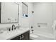 Bright bathroom with modern fixtures, marble countertop, and white subway tile shower at 3530 E Glenrosa Ave, Phoenix, AZ 85018