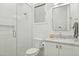 Clean and modern bathroom featuring a glass-enclosed shower and sleek white vanity at 3530 E Glenrosa Ave, Phoenix, AZ 85018